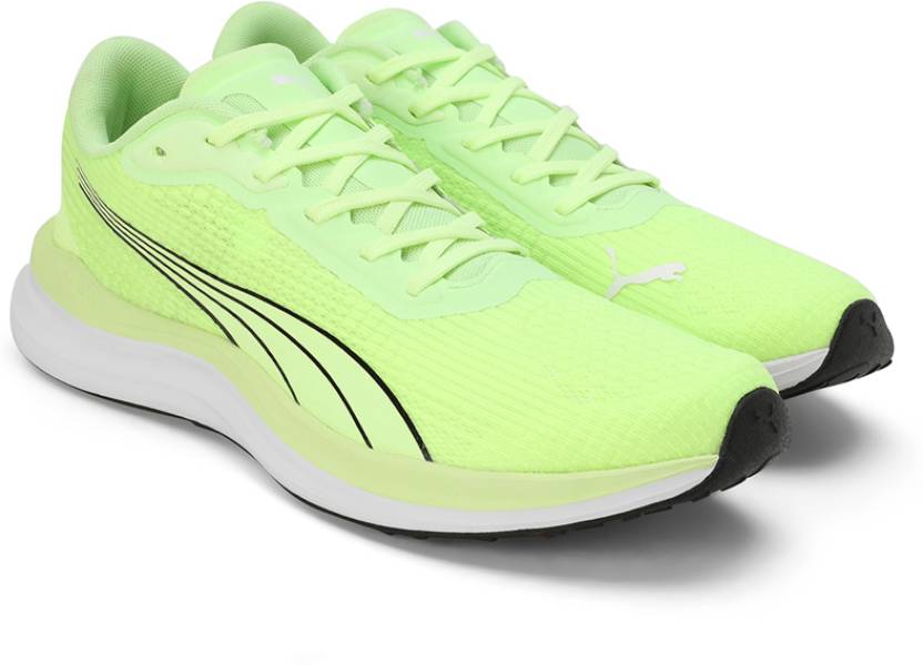 Side view of PUMA Men's Running Lace-Up Sneakers, showcasing the breathable upper, cushioned midsole, durable outsole, and iconic PUMA logo, designed for comfort and performance in running.