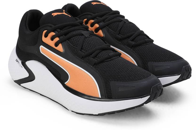 Side view of PUMA Men's Running Lace-Up Sneakers, showcasing the breathable upper, cushioned midsole, durable outsole, and iconic PUMA logo, designed for comfort and performance in running.