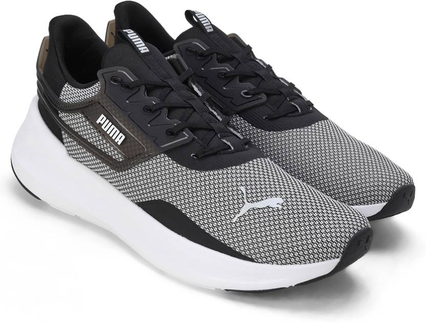 Side view of PUMA Men's Running Lace-Up Sneakers, showcasing the breathable upper, cushioned midsole, durable outsole, and iconic PUMA logo, designed for comfort and performance in running.