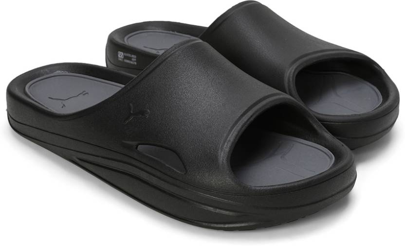 Side view of PUMA Men's Lifestyle Sandals, showcasing the adjustable straps, cushioned footbed, and iconic PUMA logo, designed for comfort and style in warm-weather activities.