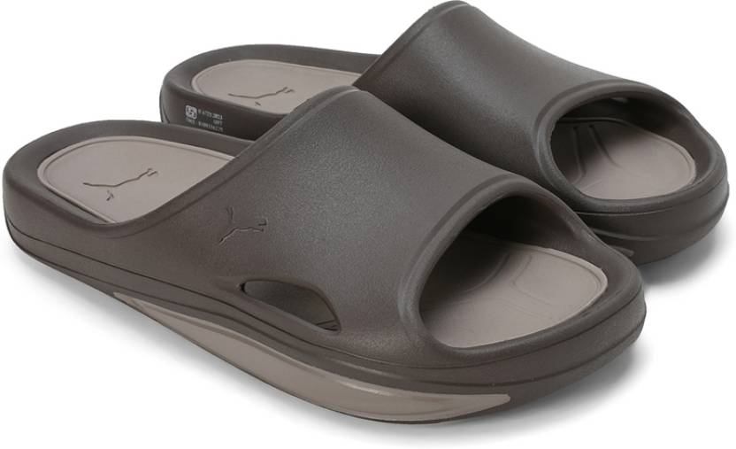 Side view of PUMA Men's Lifestyle Sandals, showcasing the adjustable straps, cushioned footbed, and iconic PUMA logo, designed for comfort and style in warm-weather activities.