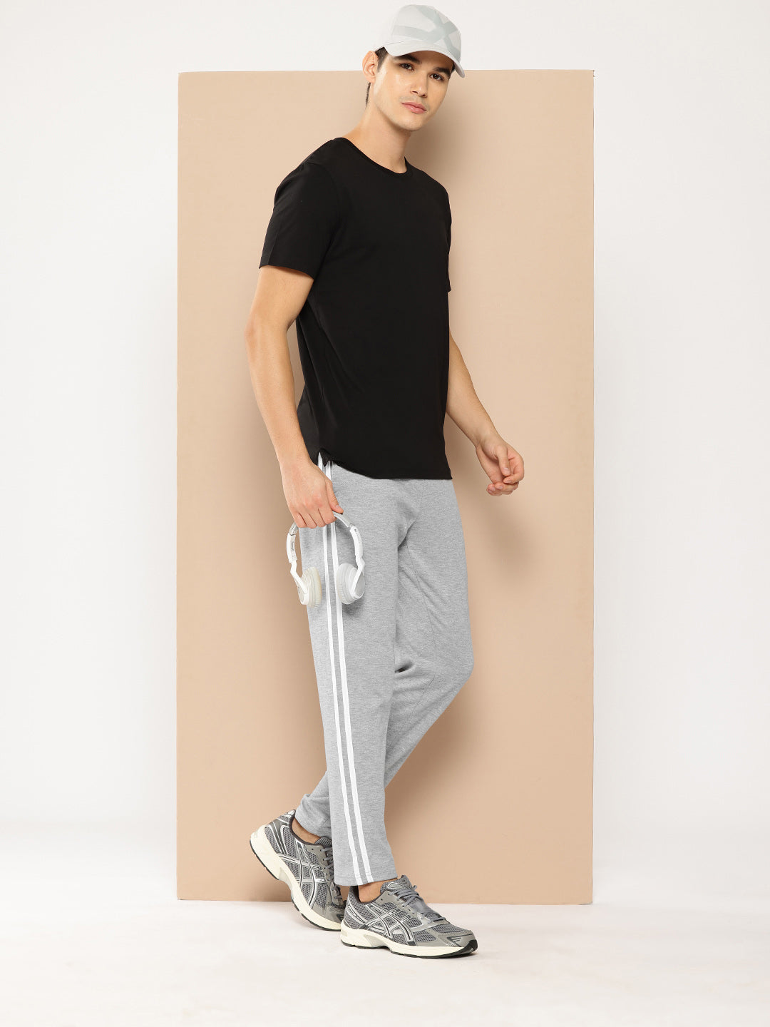 The photo displays the Alcis Men’s Lower Apparel from a front angle, focusing on the sleek design, flexible waistband, and athletic fit, with attention to the moisture-wicking fabric detail, perfect for an active lifestyle