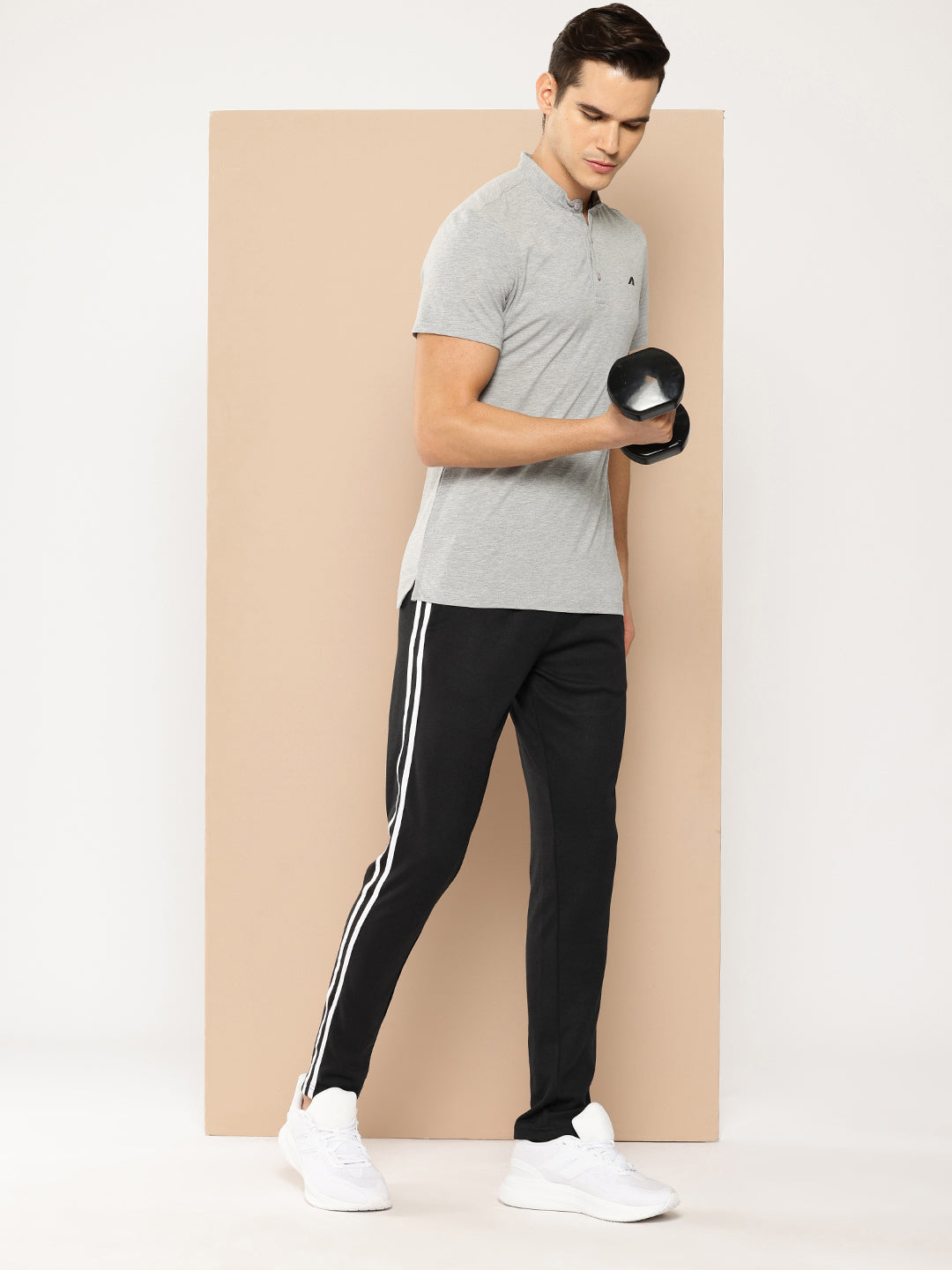 The photo displays the Alcis Men’s Lower Apparel from a front angle, focusing on the sleek design, flexible waistband, and athletic fit, with attention to the moisture-wicking fabric detail, perfect for an active lifestyle