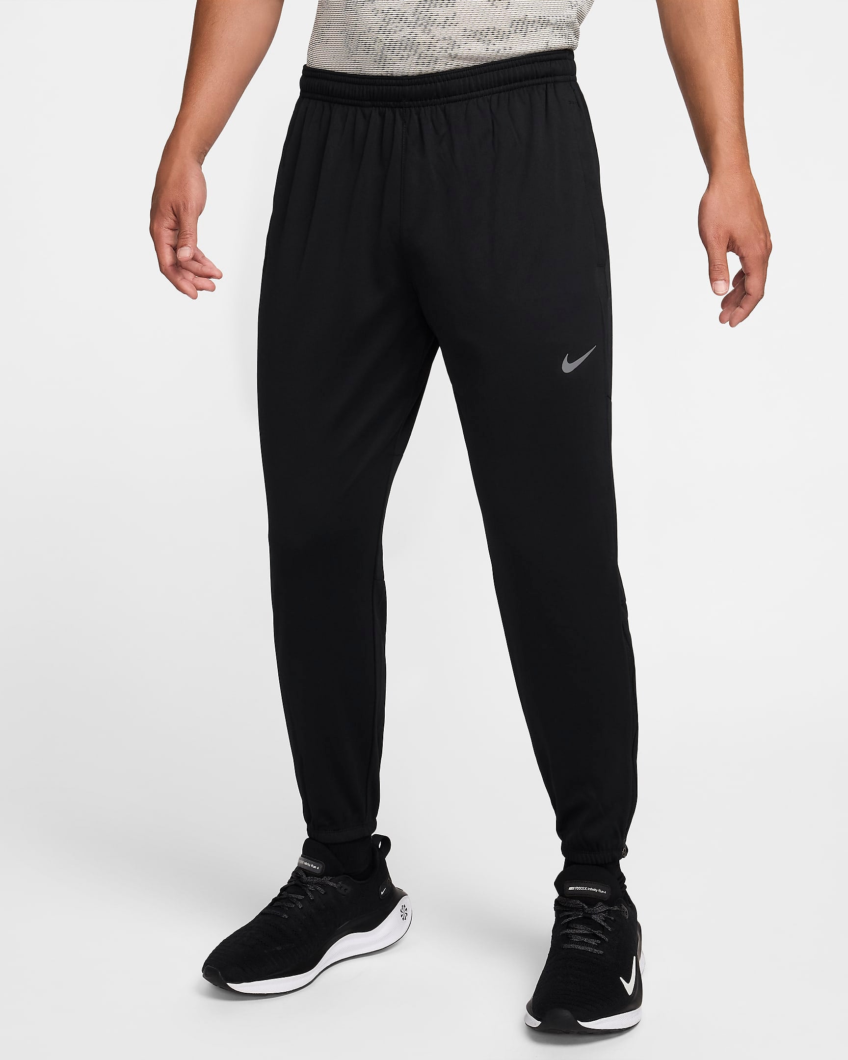 Men’s Challenger Knit Pants featuring Dri-FIT sweat-wicking fabric, a tapered fit, and an elastic waistband for comfort and performance