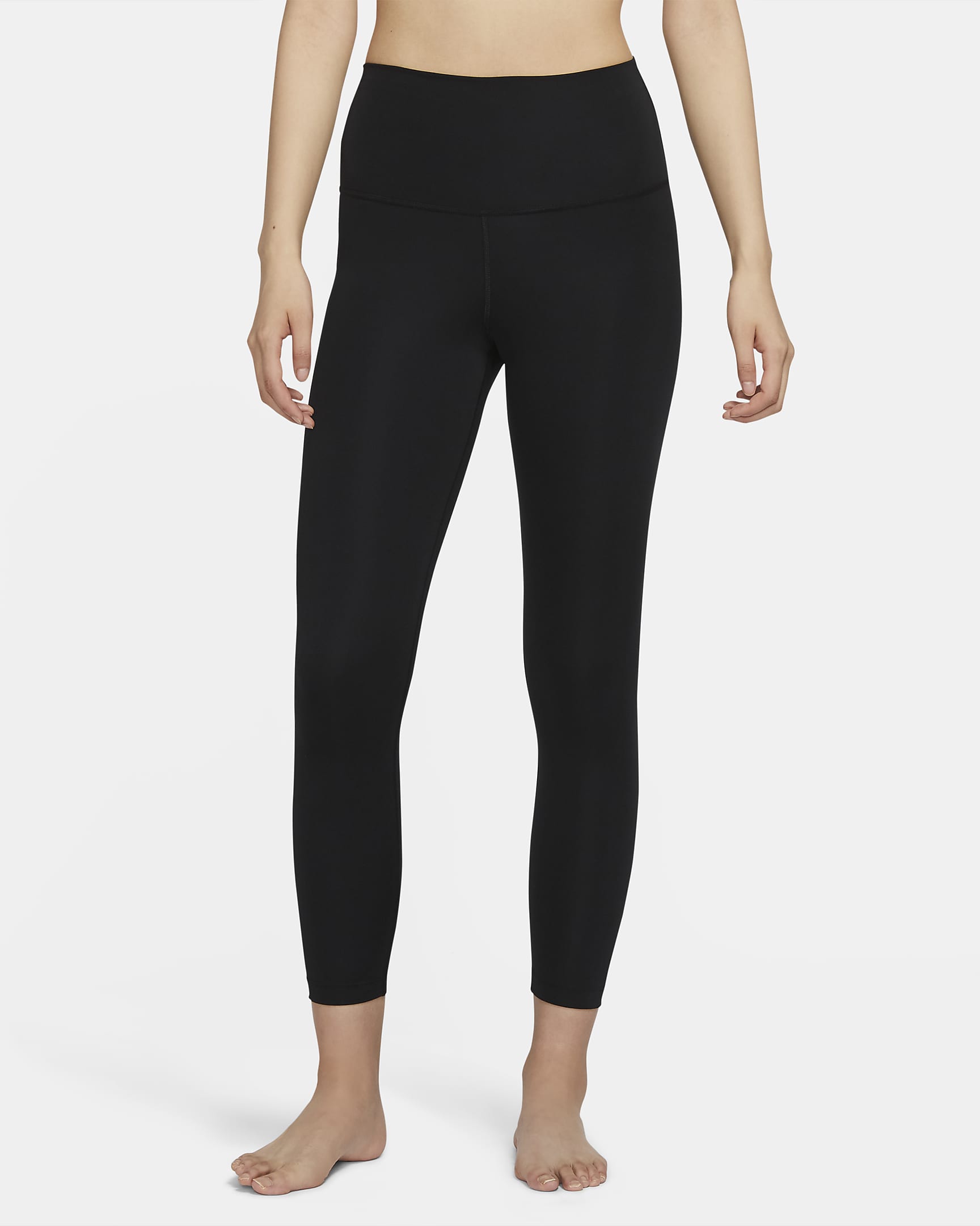 Nike Yoga 7/8 Tights featuring a high-rise waistband, sweat-wicking fabric, and a stretchy, form-fitting design for maximum comfort