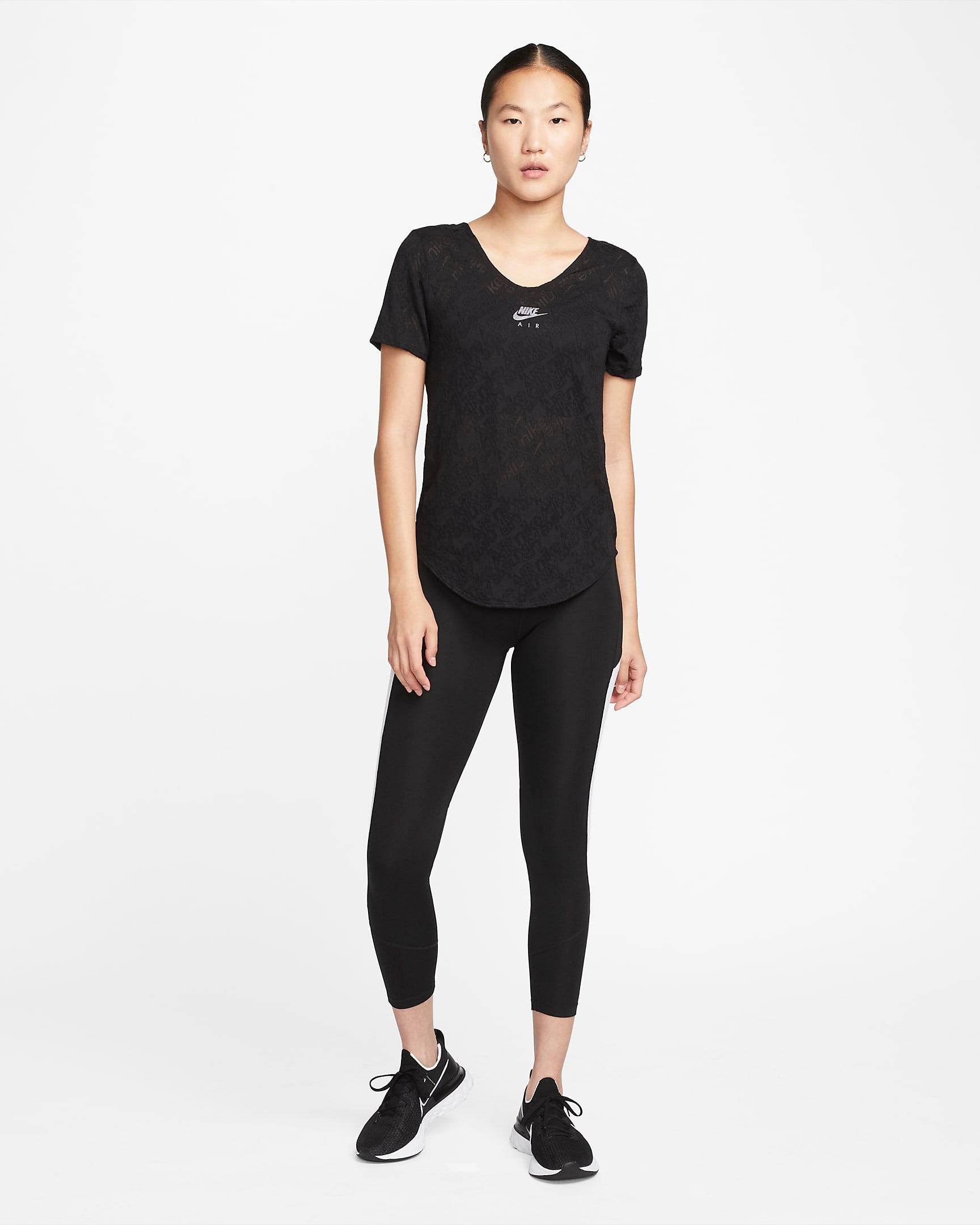 The NIKE AS W NK AIR DF SS TOP shown in a sleek black design with the iconic Nike Air logo prominently displayed, offering a modern and casual look for active women.