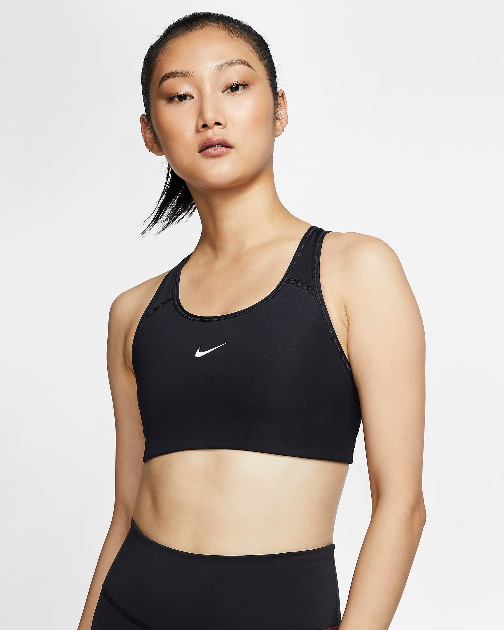 Nike Swoosh Bra Pad featuring removable padding, medium-impact support, and moisture-wicking Dri-FIT fabric for comfort and performance