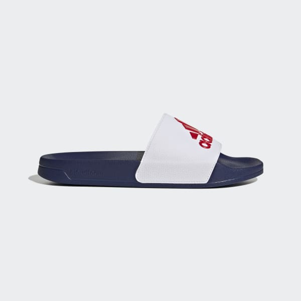 A pair of Adidas Adilette Shower Men’s Slides with a sleek, minimalist design showcasing their quick-drying material and cushioned footbed