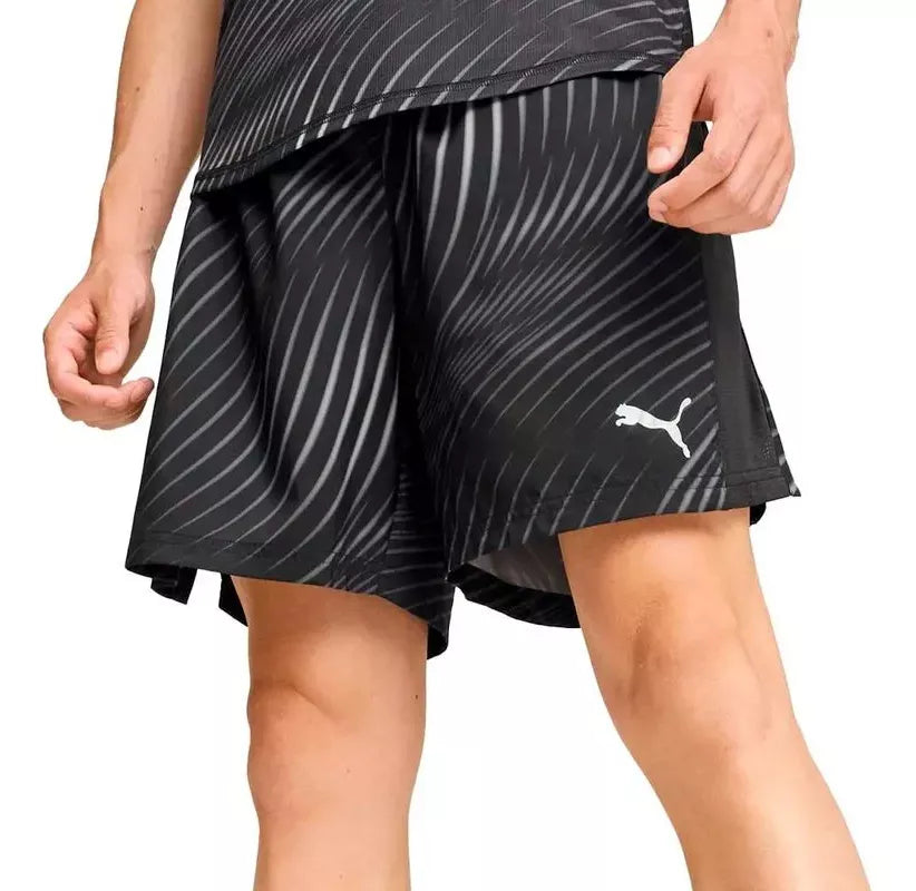 Side view of PUMA Men's Shorts, highlighting the relaxed fit, soft fabric, and signature PUMA logo for a comfortable and stylish casual look.