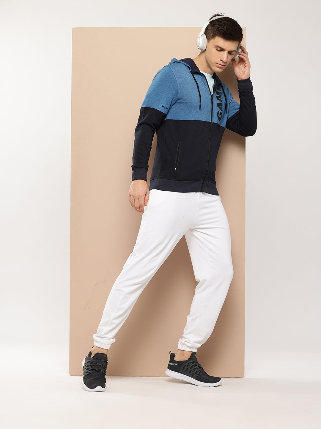 The photo shows a front view of the ALCIS Printed Men’s Jacket, highlighting its sleek printed design, zipper closure, and tailored fit, showcasing its versatility for both active and casual looks