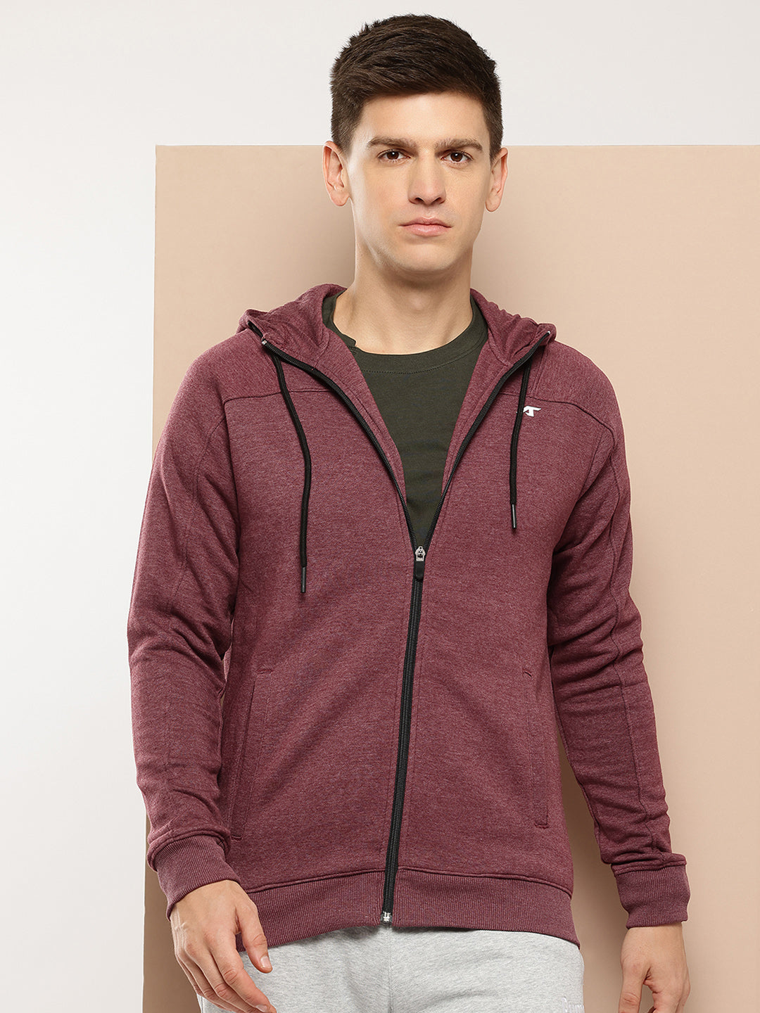 A solid jacket offering a sleek design for men, perfect for running and outdoor activities.