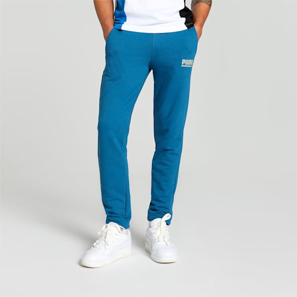 Side view of PUMA Men's Lower, showcasing its relaxed fit, breathable fabric, and signature PUMA logo for a casual, comfortable look.