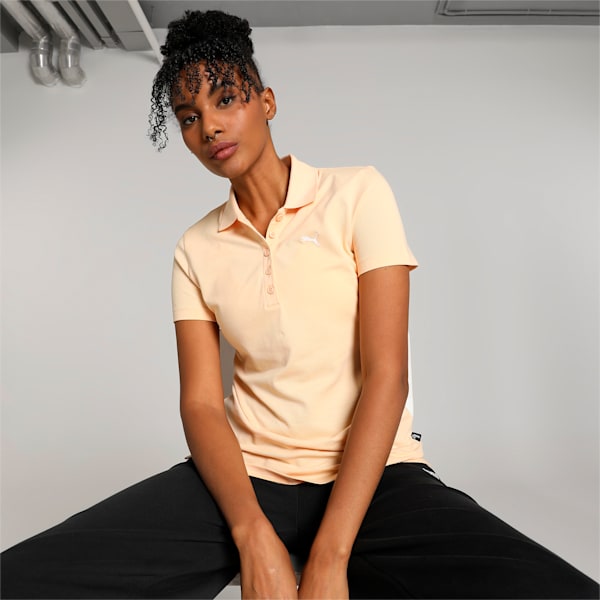 Front view of PUMA Women's Polo, highlighting the soft fabric, sleek fit, and signature PUMA logo, designed for casual and active wear.