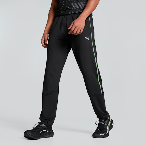 Side view of PUMA Men's Lower, showcasing its relaxed fit, breathable fabric, and signature PUMA logo for a casual, comfortable look.