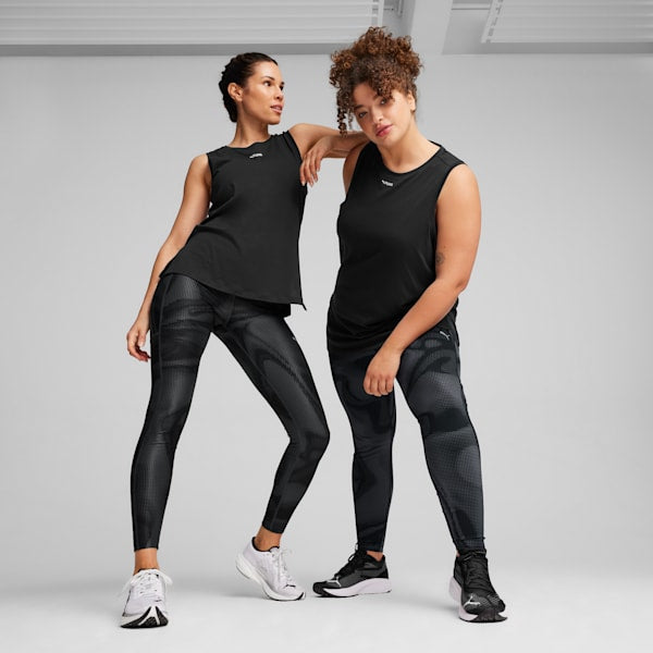 Side view of PUMA Women's Running Tights, showcasing the stretchy fabric, snug fit, and PUMA logo, designed for style and comfort during running and active workouts.