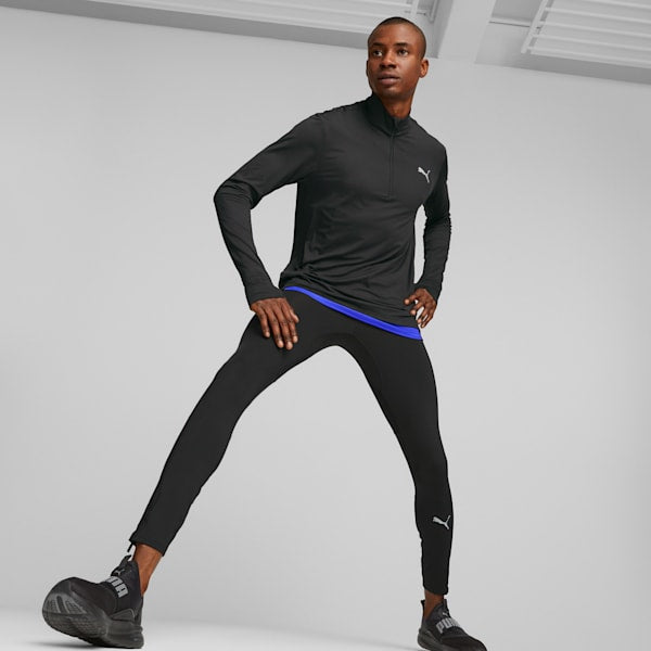 Side view of PUMA Men's Running Tights, highlighting the stretchy, breathable fabric, moisture-wicking features, and signature PUMA logo, ideal for running and active wear.