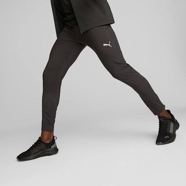 Side view of PUMA Men's Lower, highlighting the supportive fit, breathable fabric, and iconic PUMA logo for running and active wear.