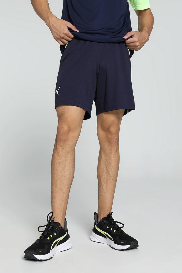 Side view of PUMA Men's Shorts, highlighting the relaxed fit, soft fabric, and signature PUMA logo for a comfortable and stylish casual look.