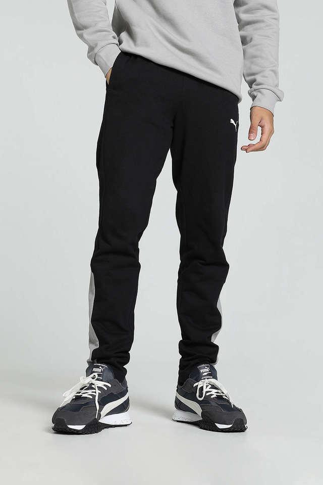 Side view of PUMA Men's Lower, showcasing its relaxed fit, breathable fabric, and signature PUMA logo for a casual, comfortable look.