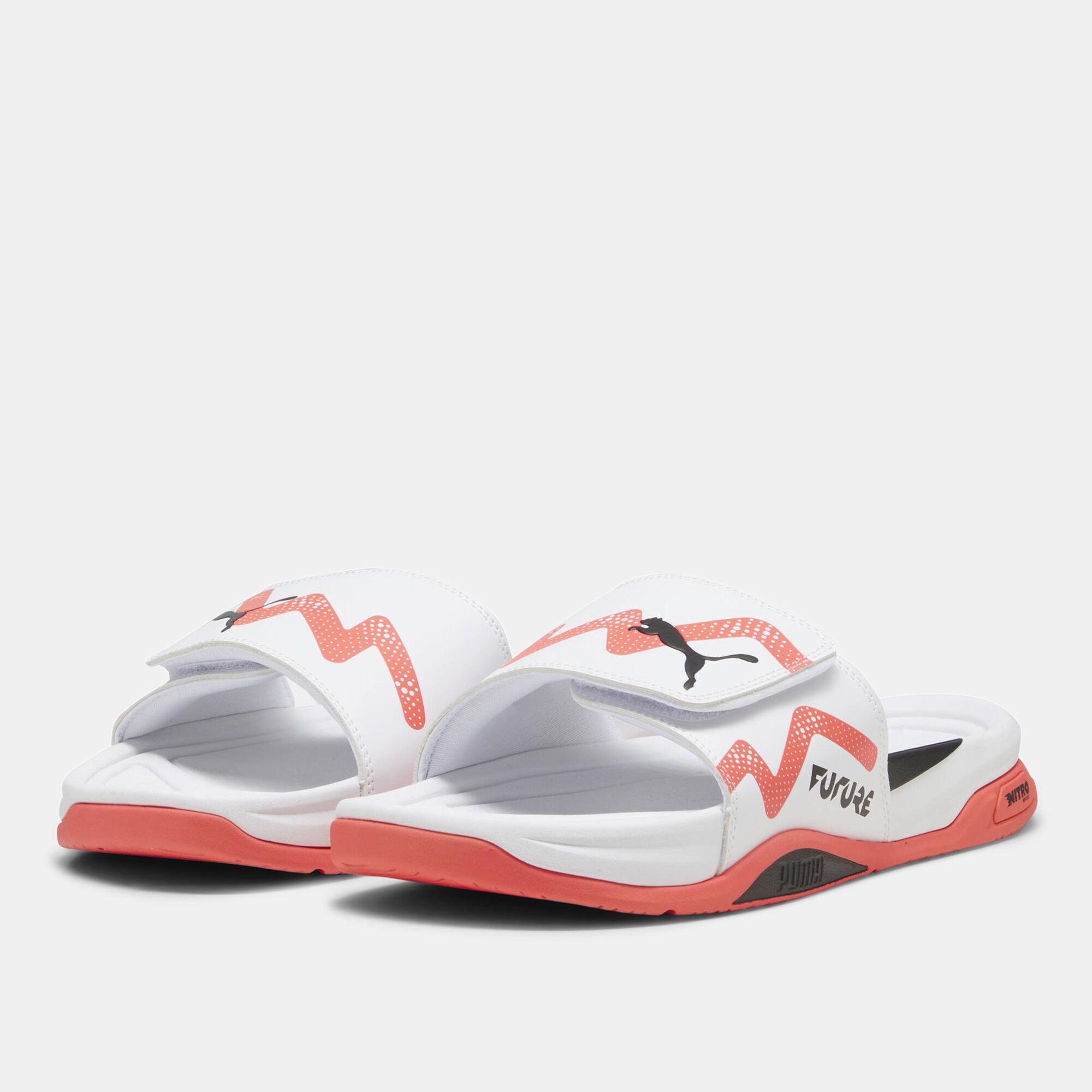 Side view of PUMA Men's Slippers, showcasing the soft plush interior, non-slip outsole, and iconic PUMA logo, designed for comfort and stability during indoor wear.