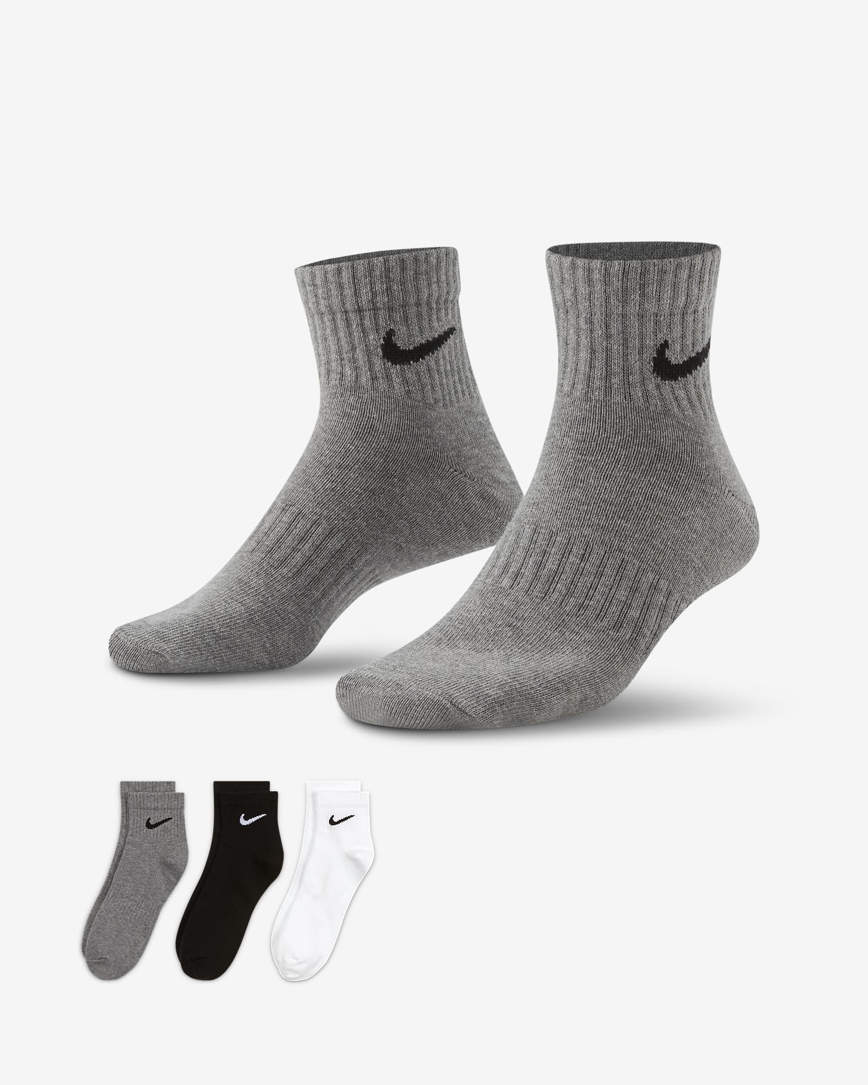 The image displays a pair of men's Nike training socks featuring a moisture-wicking design and cushioned areas for added comfort.