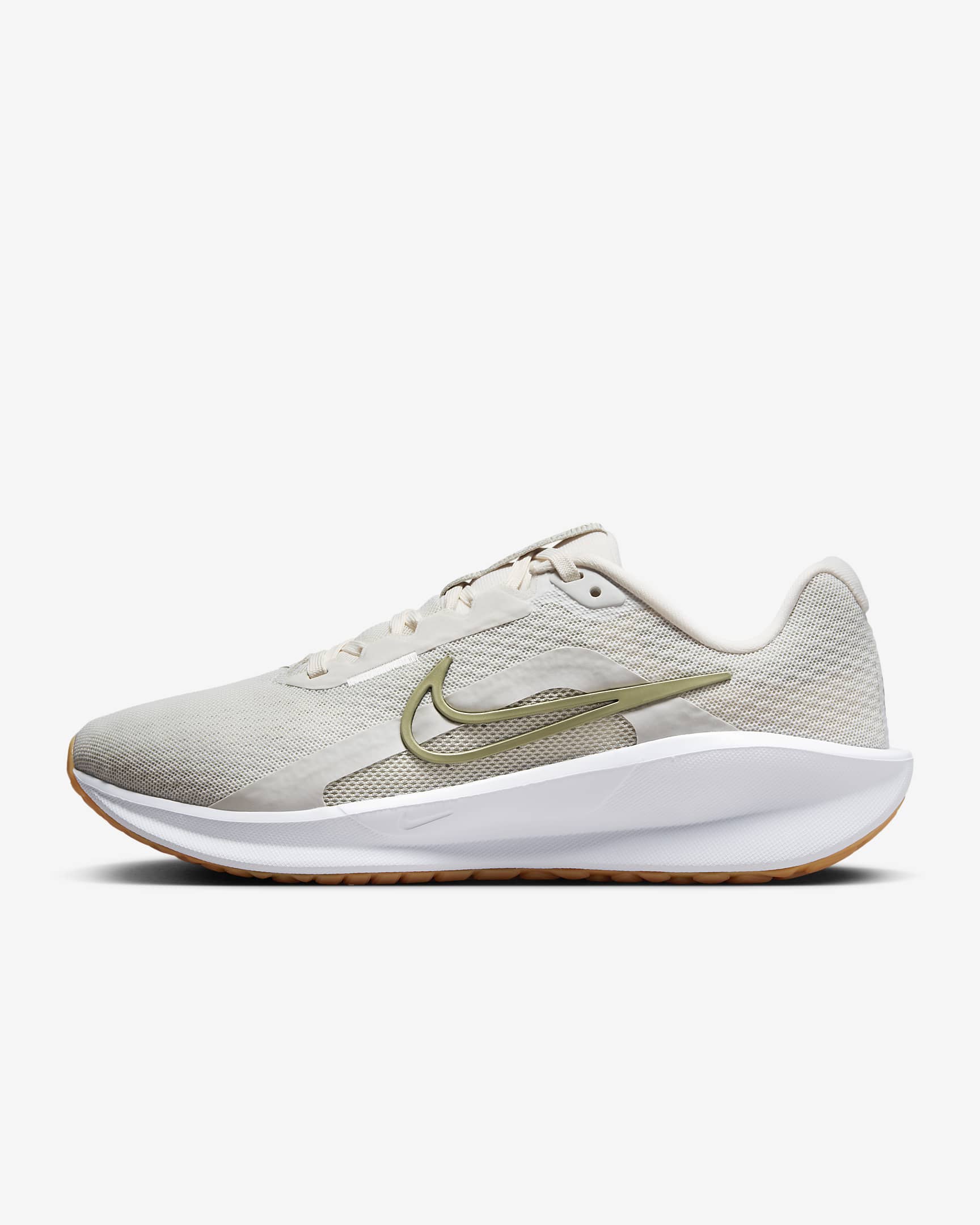 A side-angle view of Nike women’s lace-up running shoes showcasing the sleek profile, cushioned sole, and iconic Nike swoosh, set against a clean background for a modern look