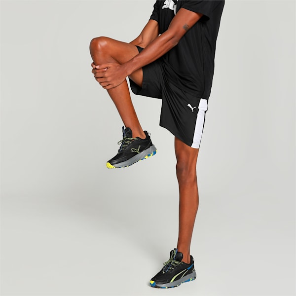 Side view of PUMA Men's Shorts, highlighting the relaxed fit, soft fabric, and signature PUMA logo for a comfortable and stylish casual look.