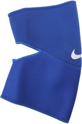 The image shows a unisex Nike elbow sleeve snugly fitted on the arm, emphasizing its supportive and flexible design.