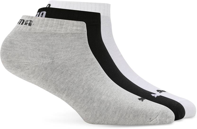 Close-up view of PUMA Unisex PO1 Socks, showcasing the soft fabric, snug fit, and iconic PUMA logo, designed for comfort and stylish everyday wear.