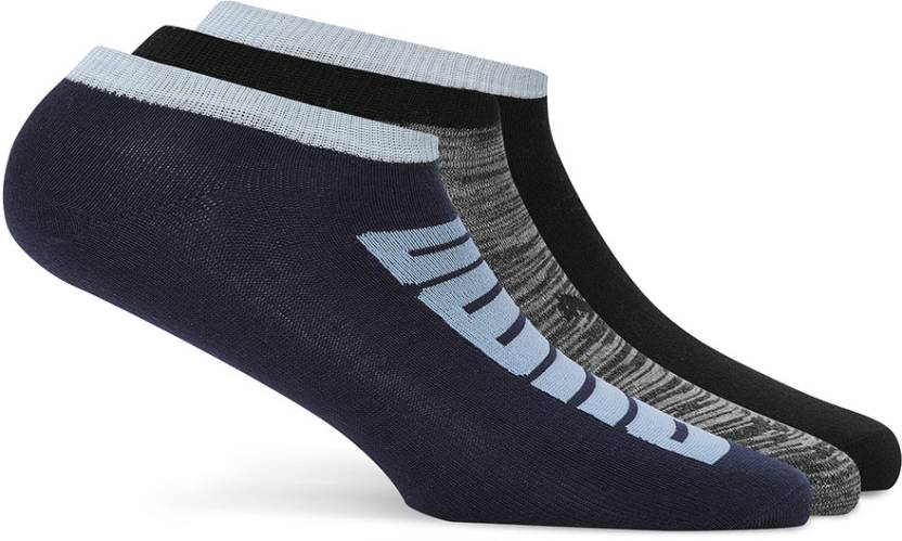 Close-up of PUMA Unisex Lifestyle PO3 Socks, highlighting the soft fabric, reinforced toe and heel areas, and the iconic PUMA logo, designed for comfort and durability in everyday wear.