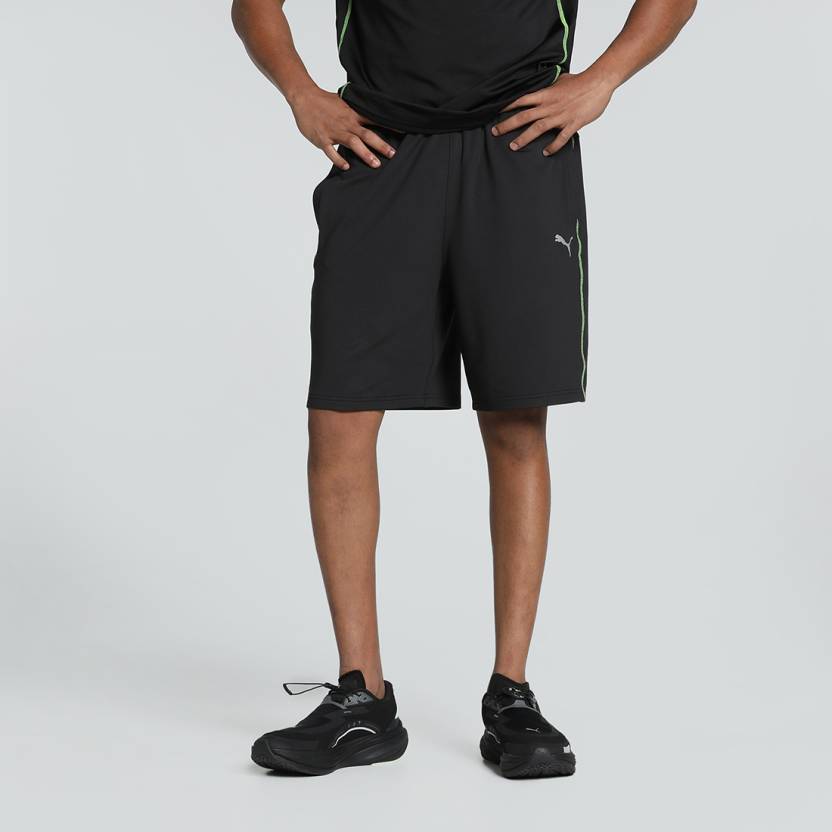 Side view of PUMA Men's Shorts, highlighting the relaxed fit, soft fabric, and signature PUMA logo for a comfortable and stylish casual look.