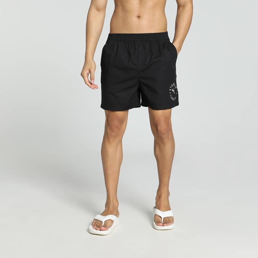 Side view of PUMA Men's Shorts, highlighting the comfortable, relaxed fit and branded waistband for everyday wear.