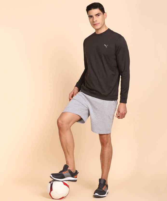 A flat-lay view of the PUMA Cloudspun Crewneck in black heather, showcasing its sleek, modern design and soft, stretchy fabric.