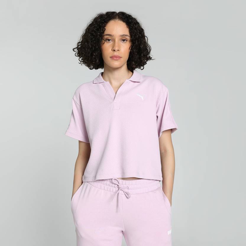 Front view of PUMA Women's Polo, highlighting the soft fabric, sleek fit, and signature PUMA logo, designed for casual and active wear.