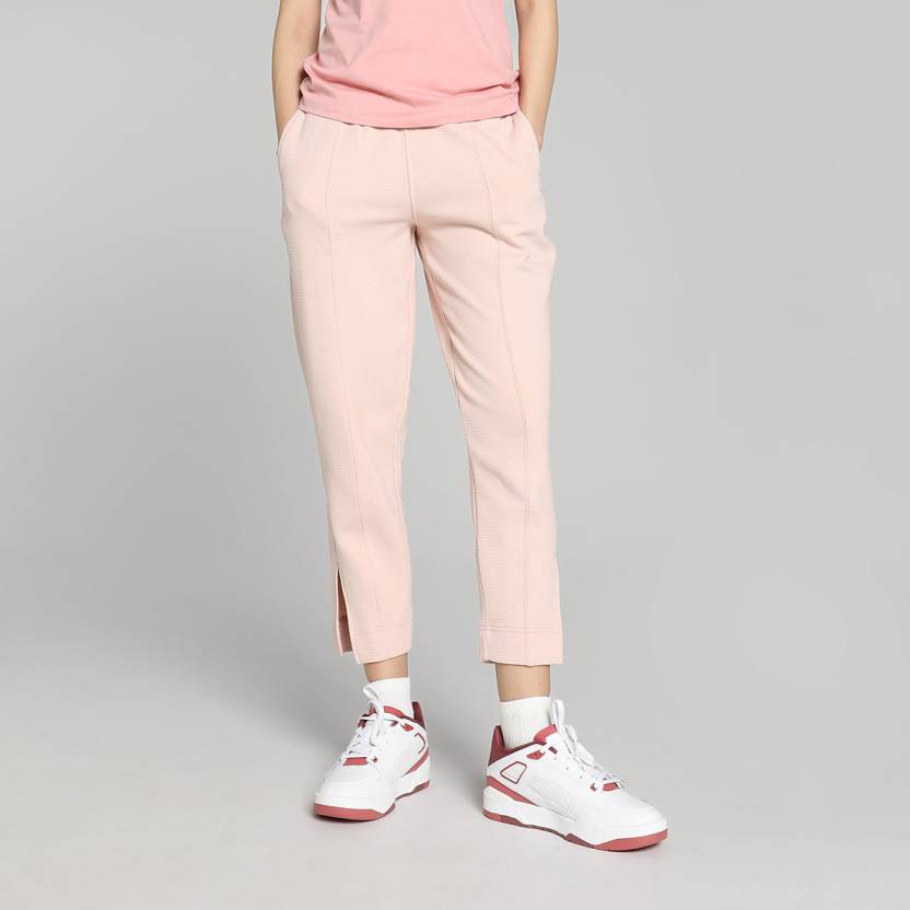 Side view of PUMA Women's Lower, highlighting the relaxed fit, soft fabric, and signature PUMA logo, perfect for casual wear and lifestyle activities.