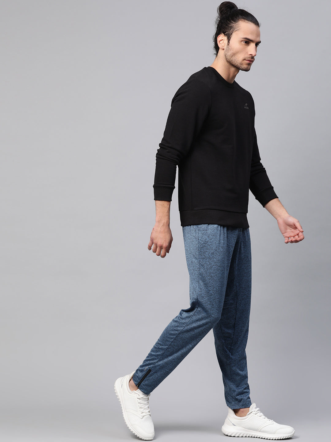 A clean and minimalist front-facing image showcasing the Alcis Men’s Sweatshirt on a mannequin, highlighting its relaxed fit, solid color, and soft fabric texture with neatly finished cuffs and hem