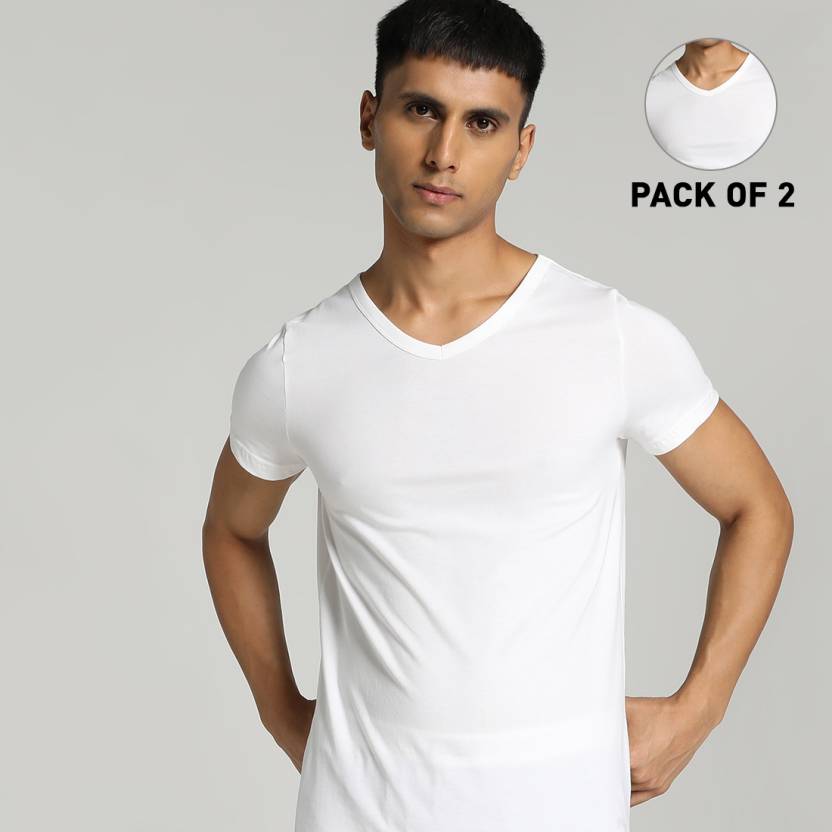 Front view of PUMA Men's Vest, highlighting the relaxed fit, breathable fabric, and signature PUMA logo for a sporty and comfortable casual look.