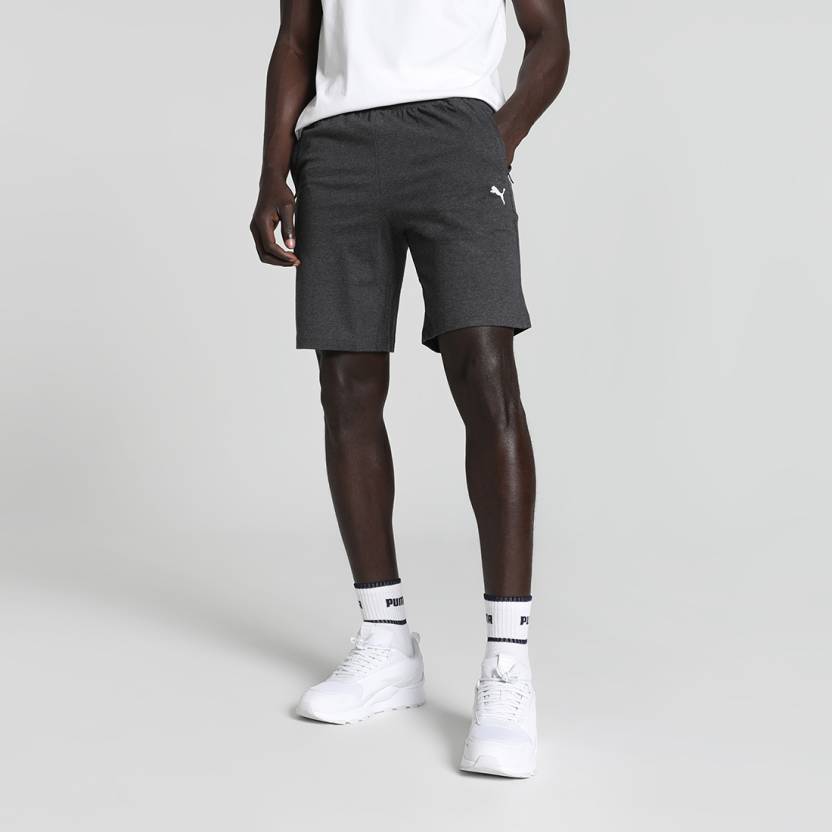 Side view of PUMA Men's Lower, showcasing its relaxed fit, breathable fabric, and signature PUMA logo for a casual, comfortable look.