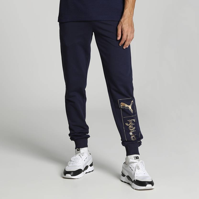 Side view of PUMA Men's Lower, showcasing its relaxed fit, breathable fabric, and signature PUMA logo for a casual, comfortable look.