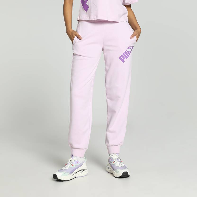 Side view of PUMA Women's Lower, highlighting the relaxed fit, soft fabric, and signature PUMA logo, perfect for casual wear and lifestyle activities.