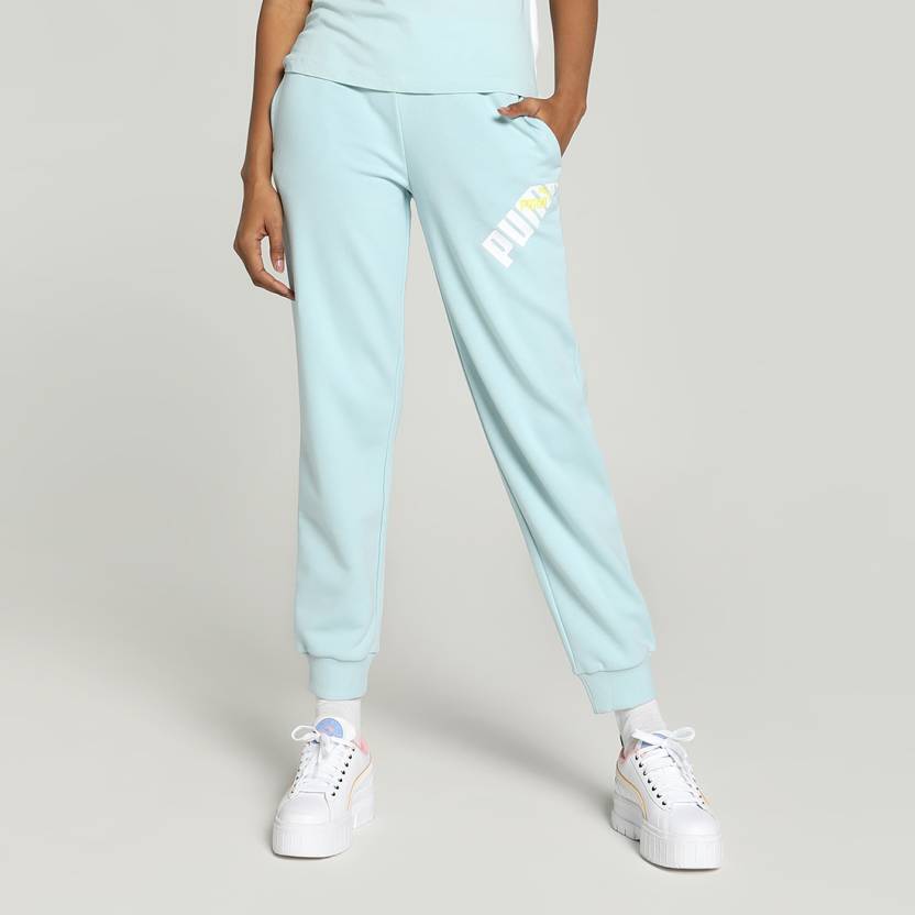 Side view of PUMA Women's Lower, highlighting the relaxed fit, soft fabric, and signature PUMA logo, perfect for casual wear and lifestyle activities.