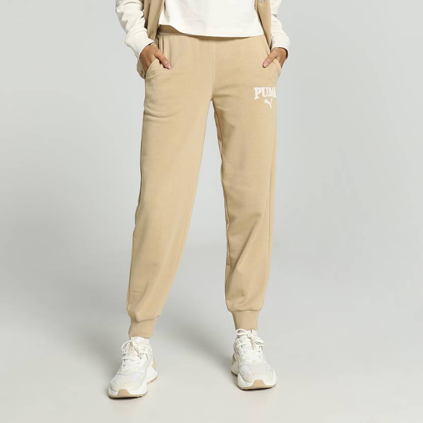 Side view of PUMA Women's Lower, highlighting the relaxed fit, soft fabric, and signature PUMA logo, perfect for casual wear and lifestyle activities.