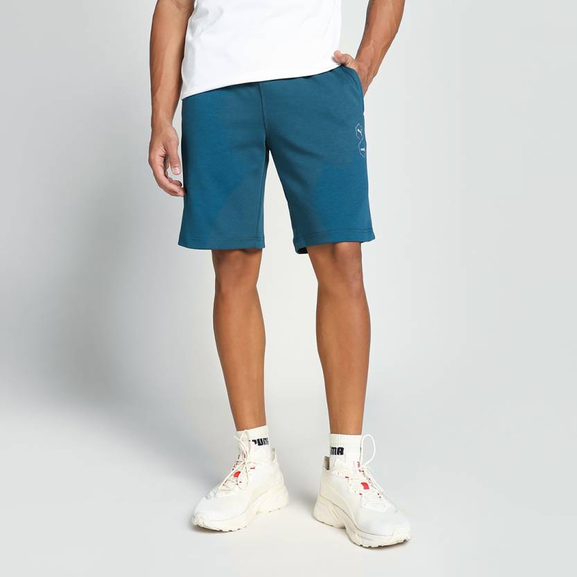 Side view of PUMA Men's Shorts, highlighting the relaxed fit, soft fabric, and signature PUMA logo for a comfortable and stylish casual look.