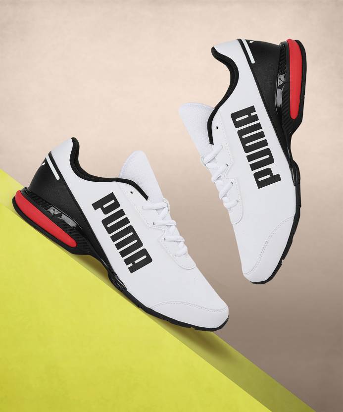 Side view of PUMA Men's Running Lace-Up Sneakers, showcasing the breathable upper, cushioned midsole, durable outsole, and iconic PUMA logo, designed for comfort and performance in running.