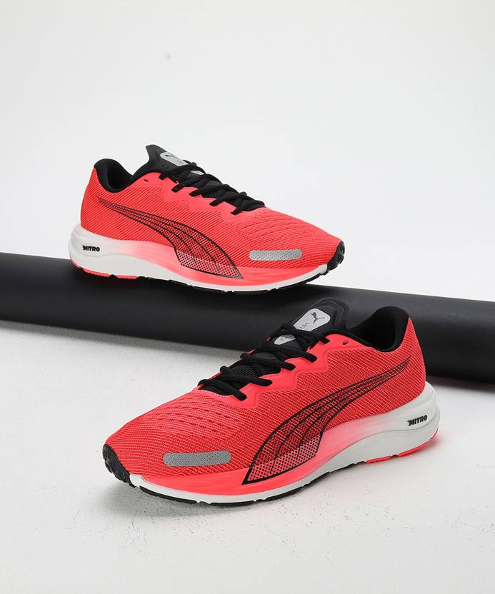 Side view of PUMA Men's Running Lace-Up Sneakers, showcasing the breathable upper, cushioned midsole, durable outsole, and iconic PUMA logo, designed for comfort and performance in running.