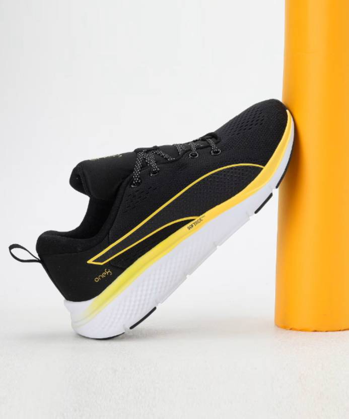 Side view of PUMA Men's Running Lace-Up Sneakers, showcasing the breathable upper, cushioned midsole, durable outsole, and iconic PUMA logo, designed for comfort and performance in running.