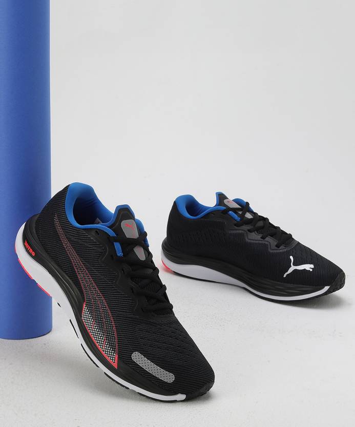 Side view of PUMA Men's Running Lace-Up Sneakers, showcasing the breathable upper, cushioned midsole, durable outsole, and iconic PUMA logo, designed for comfort and performance in running.