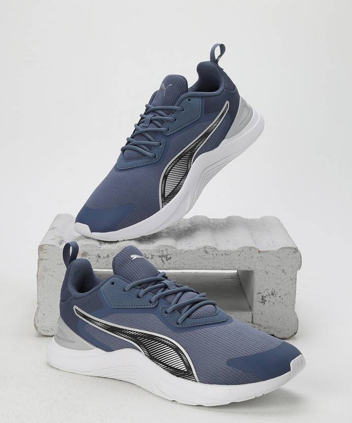 Side view of PUMA Men's Running Lace-Up Sneakers, showcasing the breathable upper, cushioned midsole, durable outsole, and iconic PUMA logo, designed for comfort and performance in running.