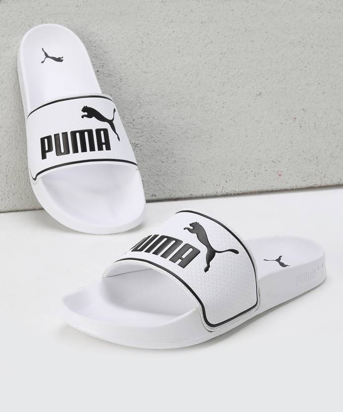 Side view of PUMA Men's Slippers, showcasing the soft plush interior, non-slip outsole, and iconic PUMA logo, designed for comfort and stability during indoor wear.