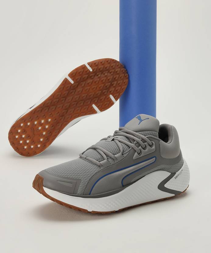 Side view of PUMA Men's Running Lace-Up Sneakers, showcasing the breathable upper, cushioned midsole, durable outsole, and iconic PUMA logo, designed for comfort and performance in running.